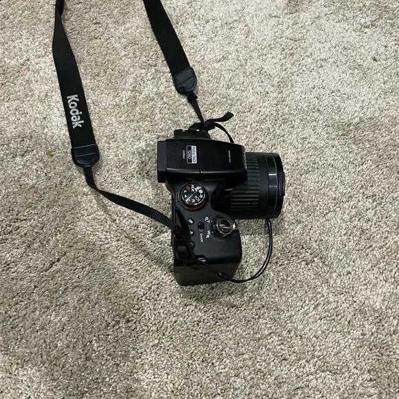 Black Kodak camera with accessories
